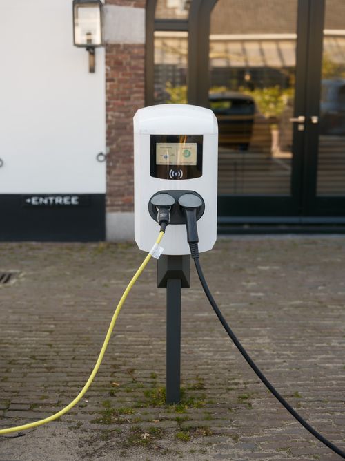 Home electric vehicle charger installed on a wall
